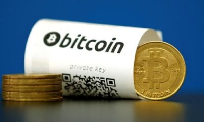 An illustration photo shows a Bitcoin (virtual currency) paper wallet with QR codes and a coin