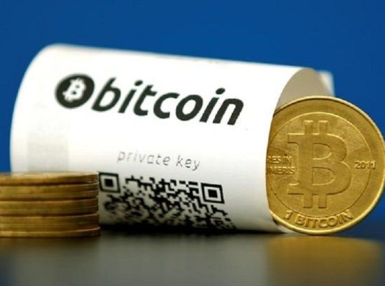 An illustration photo shows a Bitcoin (virtual currency) paper wallet with QR codes and a coin