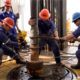 fourteen oil workers