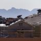 Roofers work on new homes at a residential construction site in the west side of the Las Vegas Valley in Las Vegas
