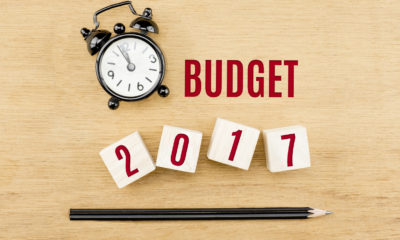 Budget 2017 year on cube with pencil and clock