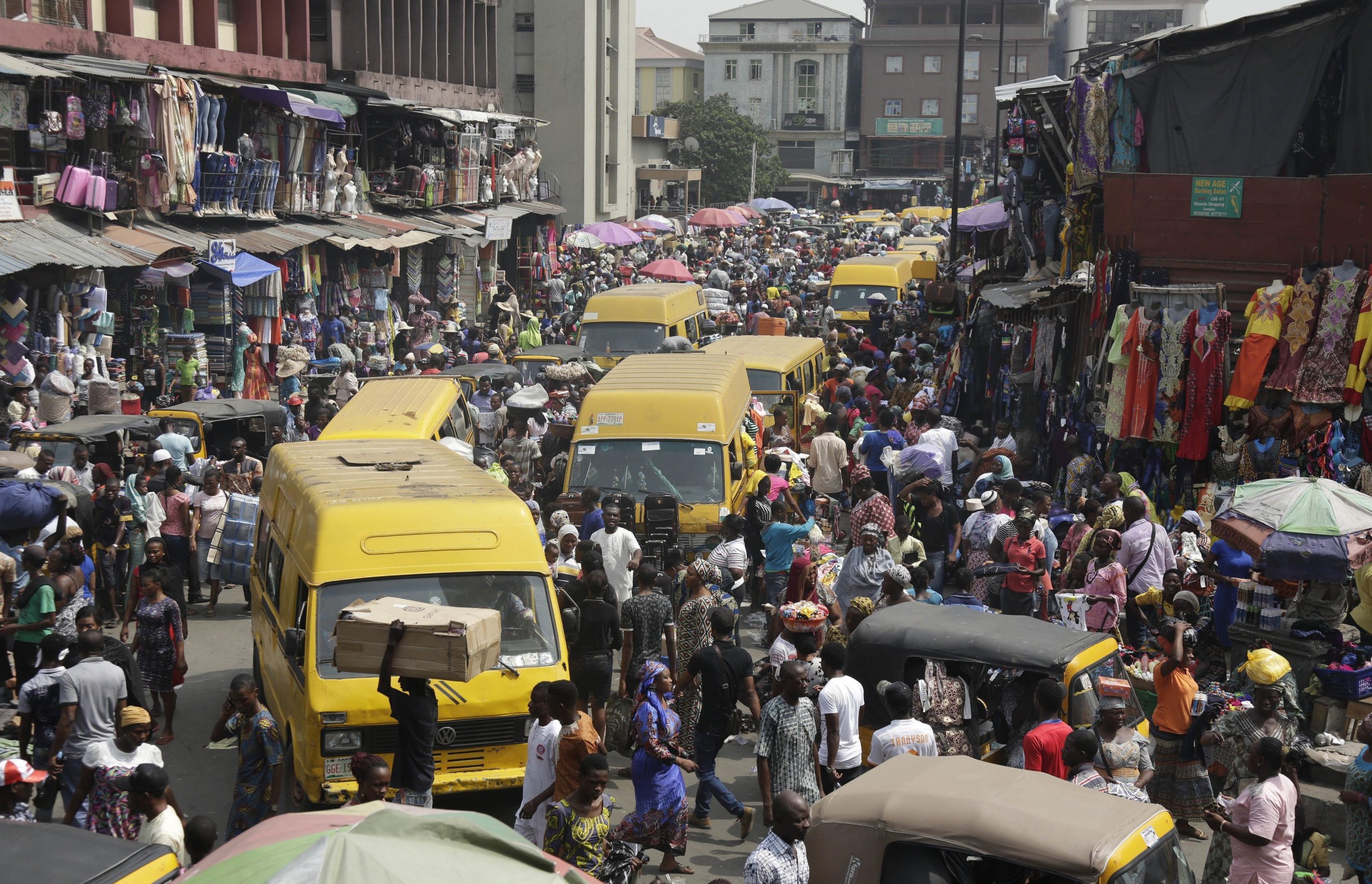 pedestrians-shop-in-balogun-market-in-lagos-nigeria-on-dec-23-photo-sunday-alambaassociated-press